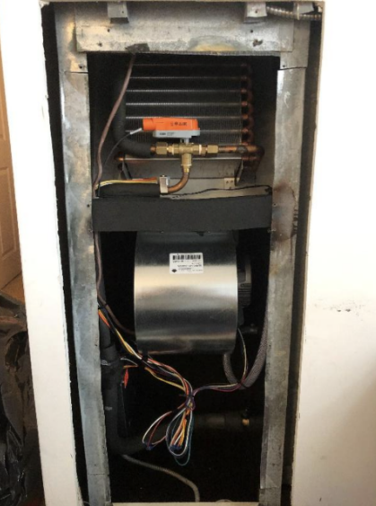 New Aurum fan coil unit installed via mechanical contracting, featuring high-quality insulation and wiring.